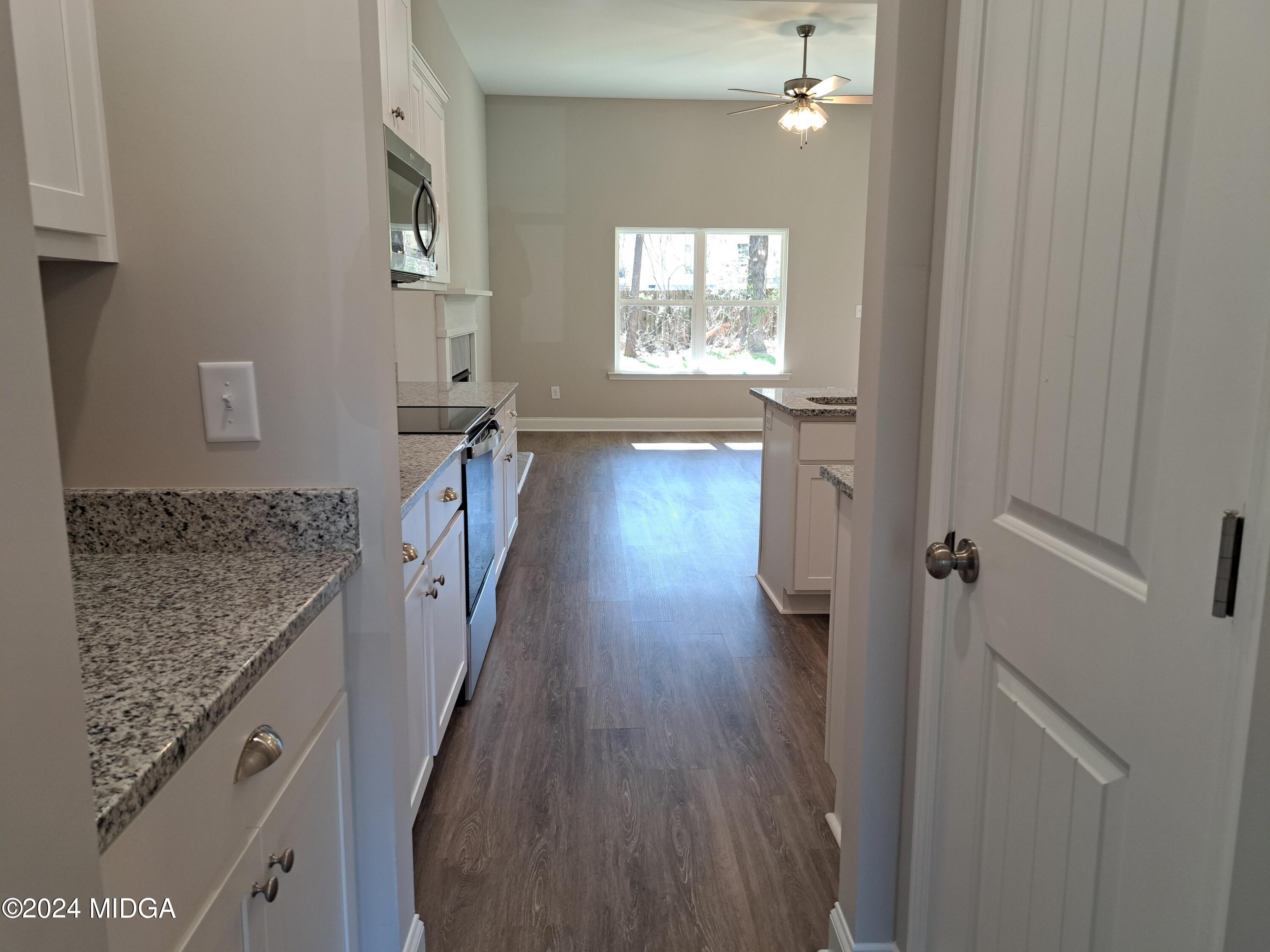 368 Walnut Grove Road Gray, GA 31032 - Photo 7 of 32 a hallway with wooden floor chandelier and livingroom