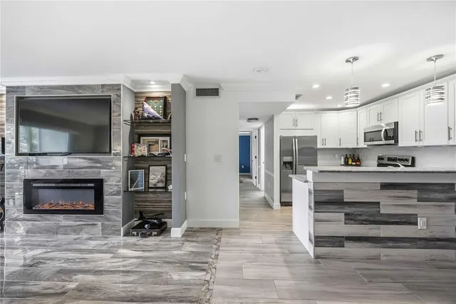 a large kitchen with a table and chairs