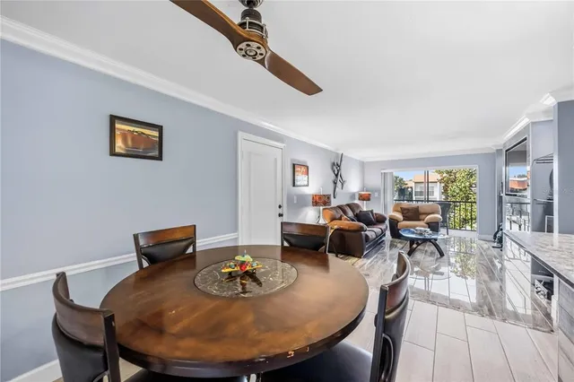 a kitchen with stainless steel appliances granite countertop a refrigerator stove microwave and sink