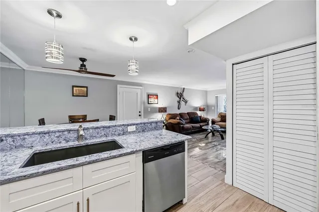 a bedroom with a bed closet and a window