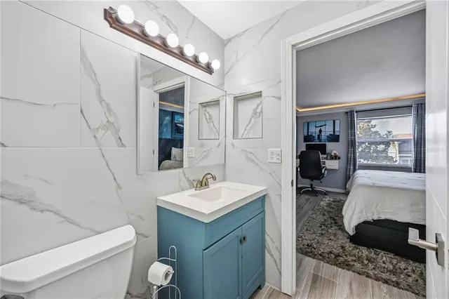 a bedroom with a bed and a dresser