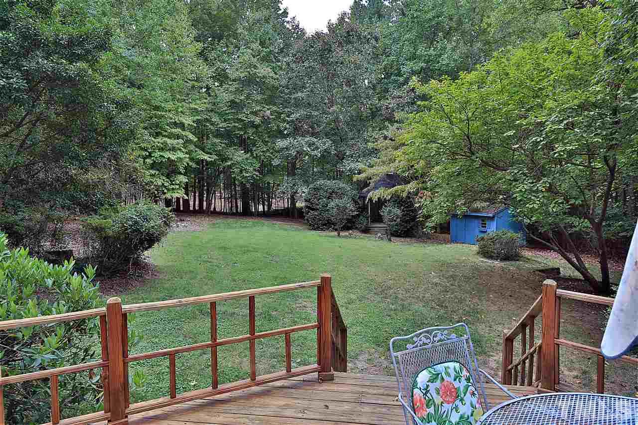 113 Trotters Ridge Drive Raleigh, NC 27614 - Photo 2 of 25 Large and Open Backyard hosting a Storage Building and Gazebo.