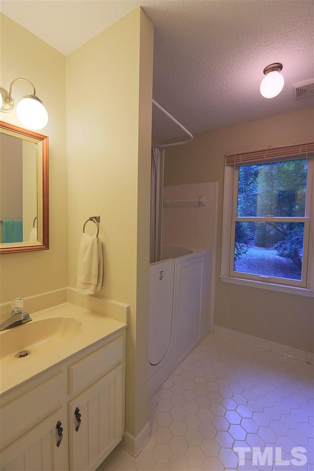 113 Trotters Ridge Drive Raleigh, NC 27614 - Photo 11 of 25 First Floor Bathroom with Walk-in Bathtub.