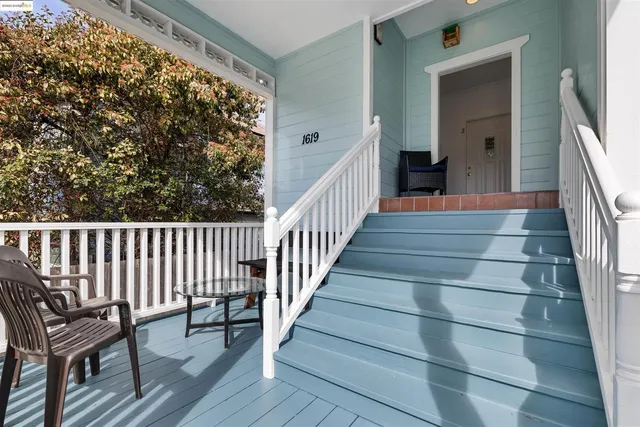 a view of entryway with wooden floor and a front door