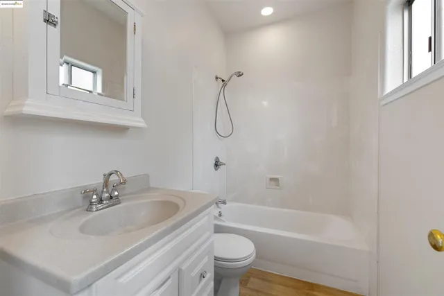 a bathroom with a sink toilet and bathtub