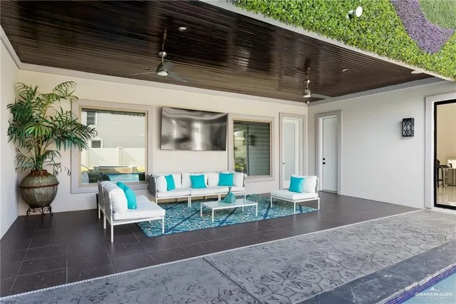 an aerial view of a house with a swimming pool