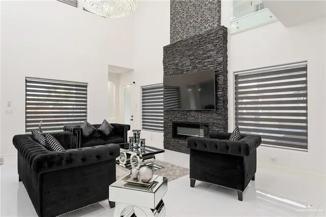 a living room with furniture and a fireplace