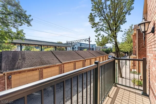 a view of a balcony with two chairs and a table