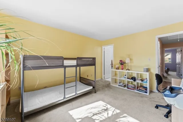 a bedroom with sliding door and a window