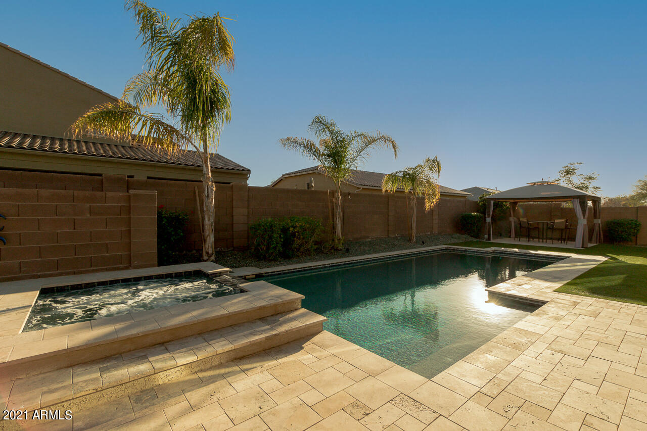 2237 East Saddlebrook Road Gilbert, AZ 85298 - Photo 41 of 49 Jacuzzi/pool/travertine deck
