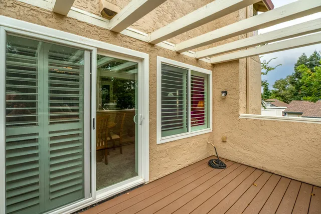 a view of porch with wooden floor