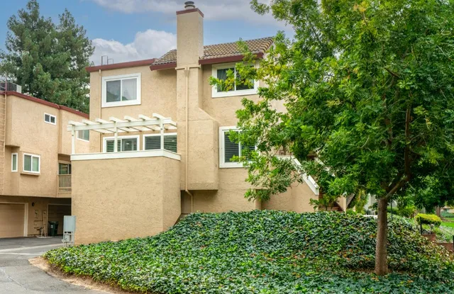 front view of a house with a garden