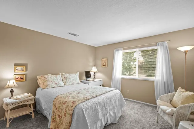 a bedroom with a bed and a tv