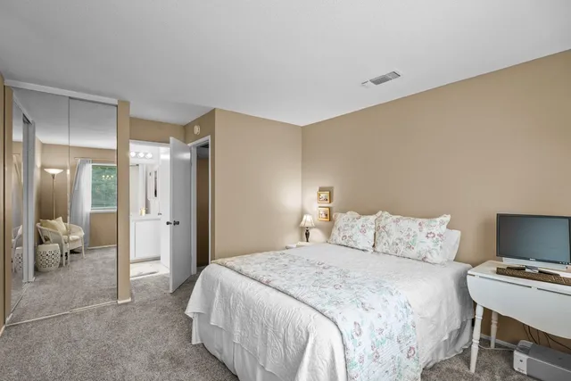 a bedroom with a bed and furniture