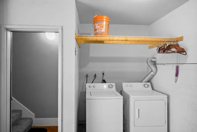a view of a yard with wooden fence