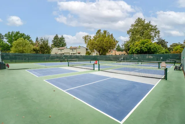 an aerial view of house with yard swimming pool and lake view