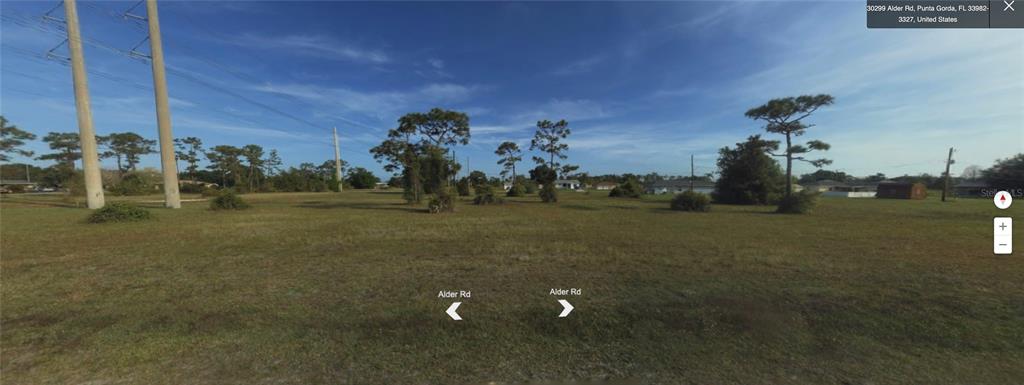 30298 Alder Road Punta Gorda, FL 33982 - Photo 1 of 1 a view of a golf course with a lake