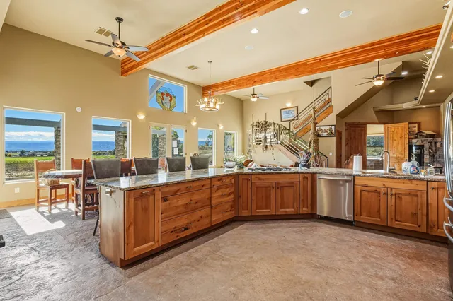 a large kitchen with a large counter top space