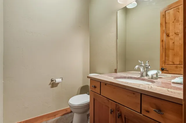 a bedroom with a bed and cabinets