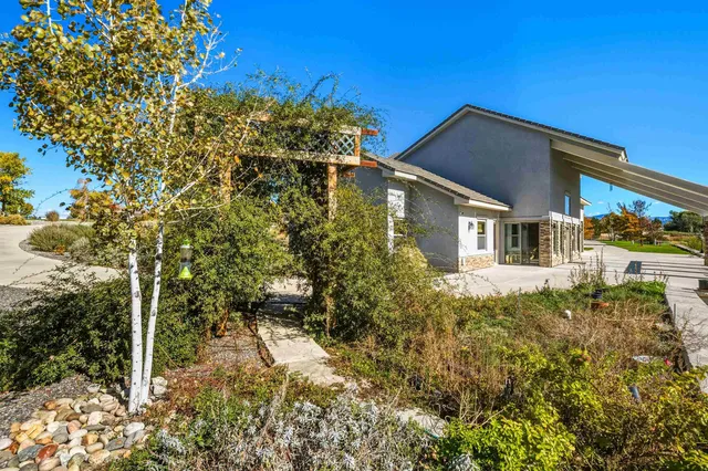 a yellow house with trees in front of it
