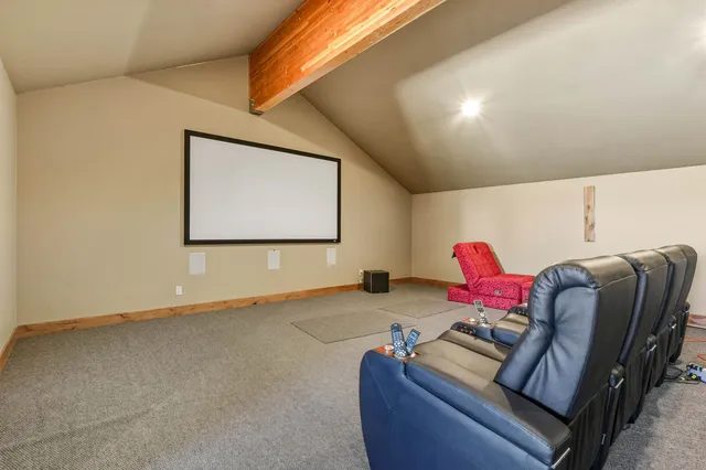 a spacious bedroom with a bed and a walk in closet