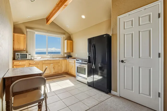 a living room with furniture and a ceiling fan