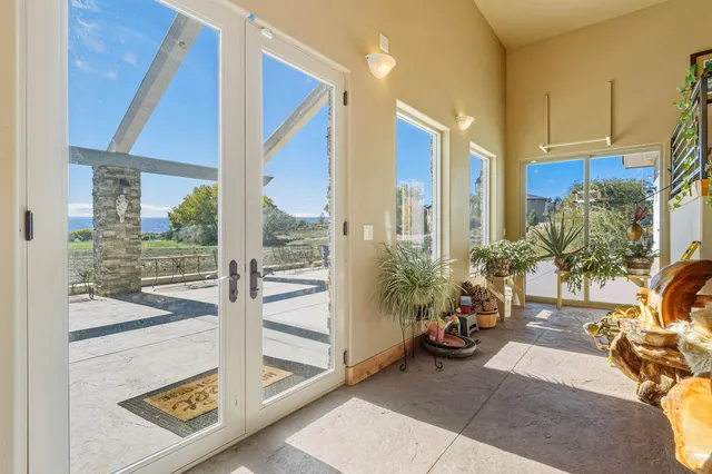 a view of a living room and a balcony
