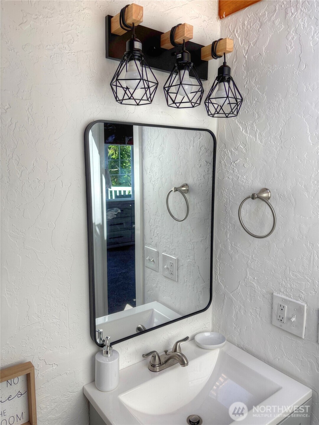 81 East Panorama Way Grapeview, WA 98546 - Photo 14 of 21 a bathroom with a sink and a mirror