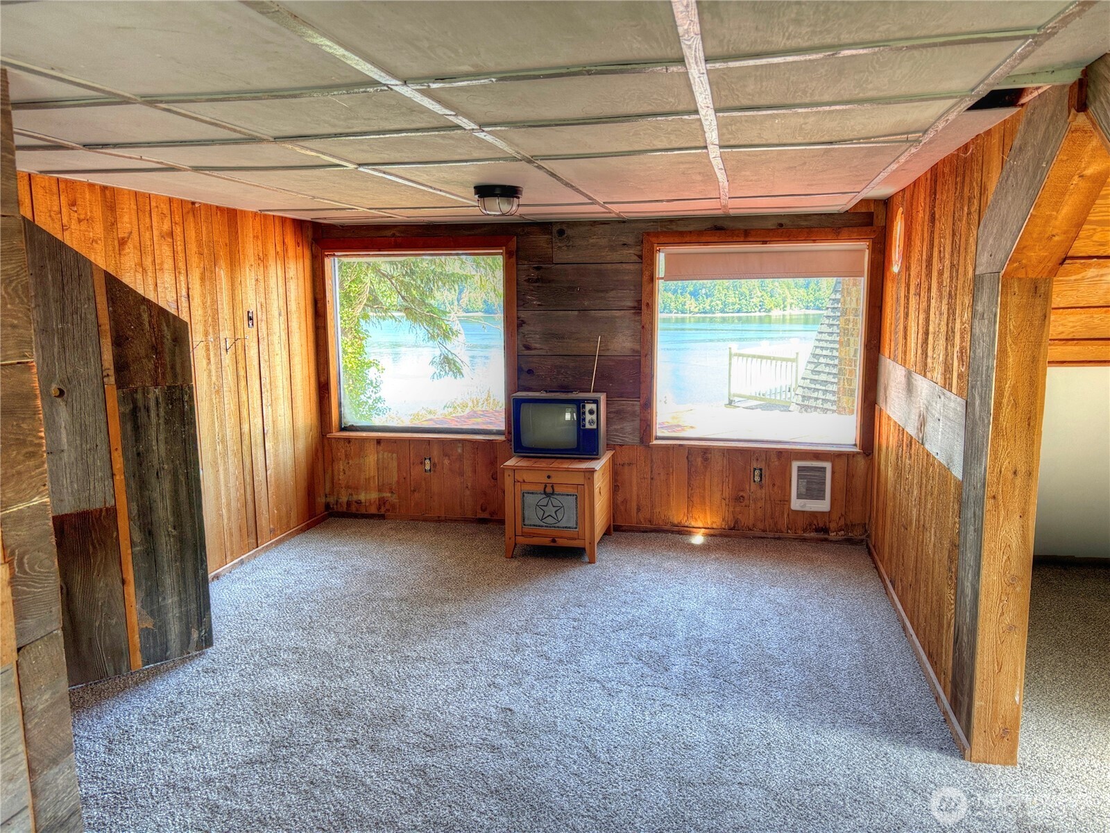 81 East Panorama Way Grapeview, WA 98546 - Photo 16 of 21 a view of an empty room with a fireplace and a window