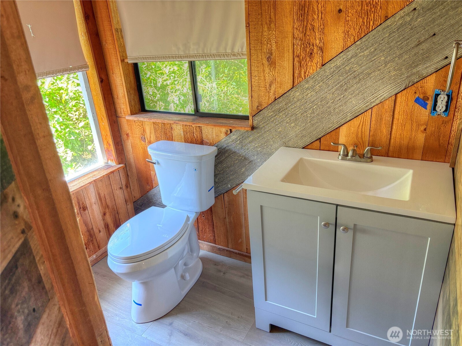 81 East Panorama Way Grapeview, WA 98546 - Photo 17 of 21 a bathroom with a toilet sink and mirror