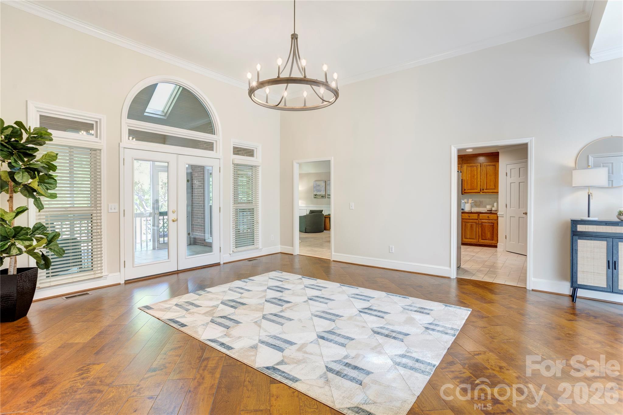 1188 Fawn Ridge Road Northwest Concord, NC 28027 - Photo 8 of 38 a view of an empty room with wooden floor and a dining table