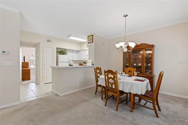 a kitchen with stainless steel appliances a sink and a refrigerator