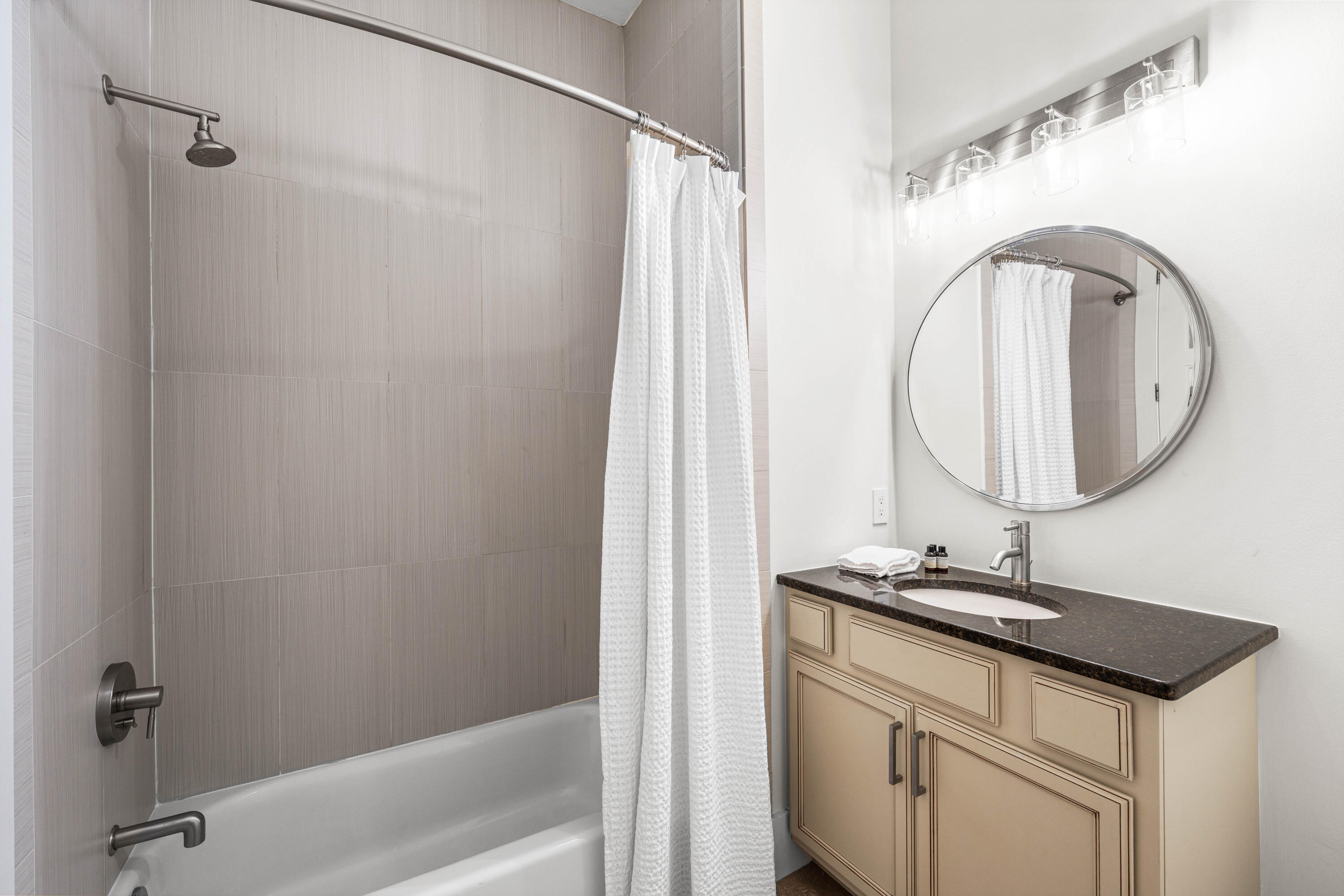 114 Pine Needle Way Santa Rosa Beach, FL 32459 - Photo 12 of 66 a bathroom with a granite countertop sink a mirror and a shower