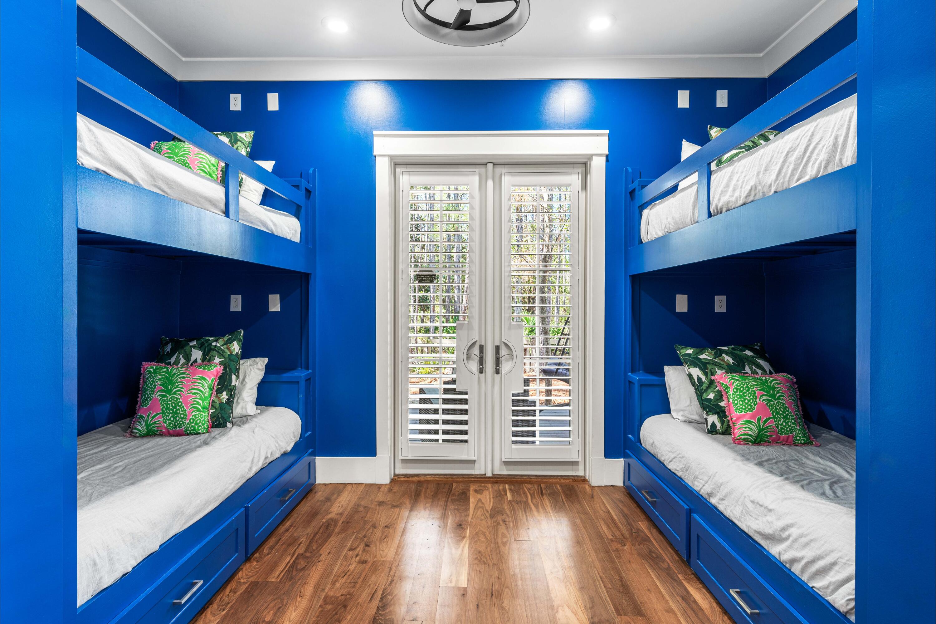 114 Pine Needle Way Santa Rosa Beach, FL 32459 - Photo 13 of 66 a bedroom with furniture and a wooden floor