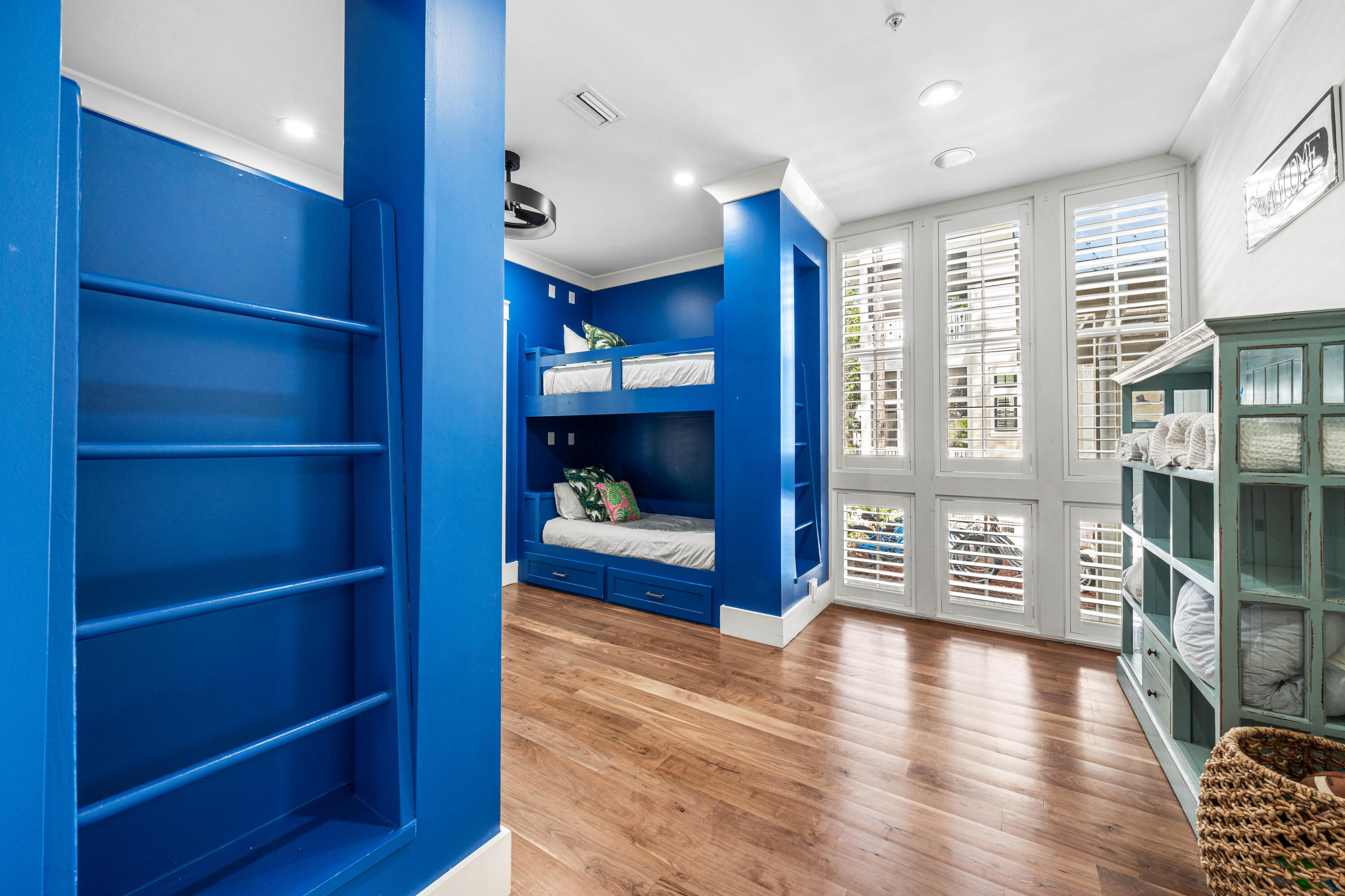 114 Pine Needle Way Santa Rosa Beach, FL 32459 - Photo 14 of 66 a view of a hallway with wooden floor and windows