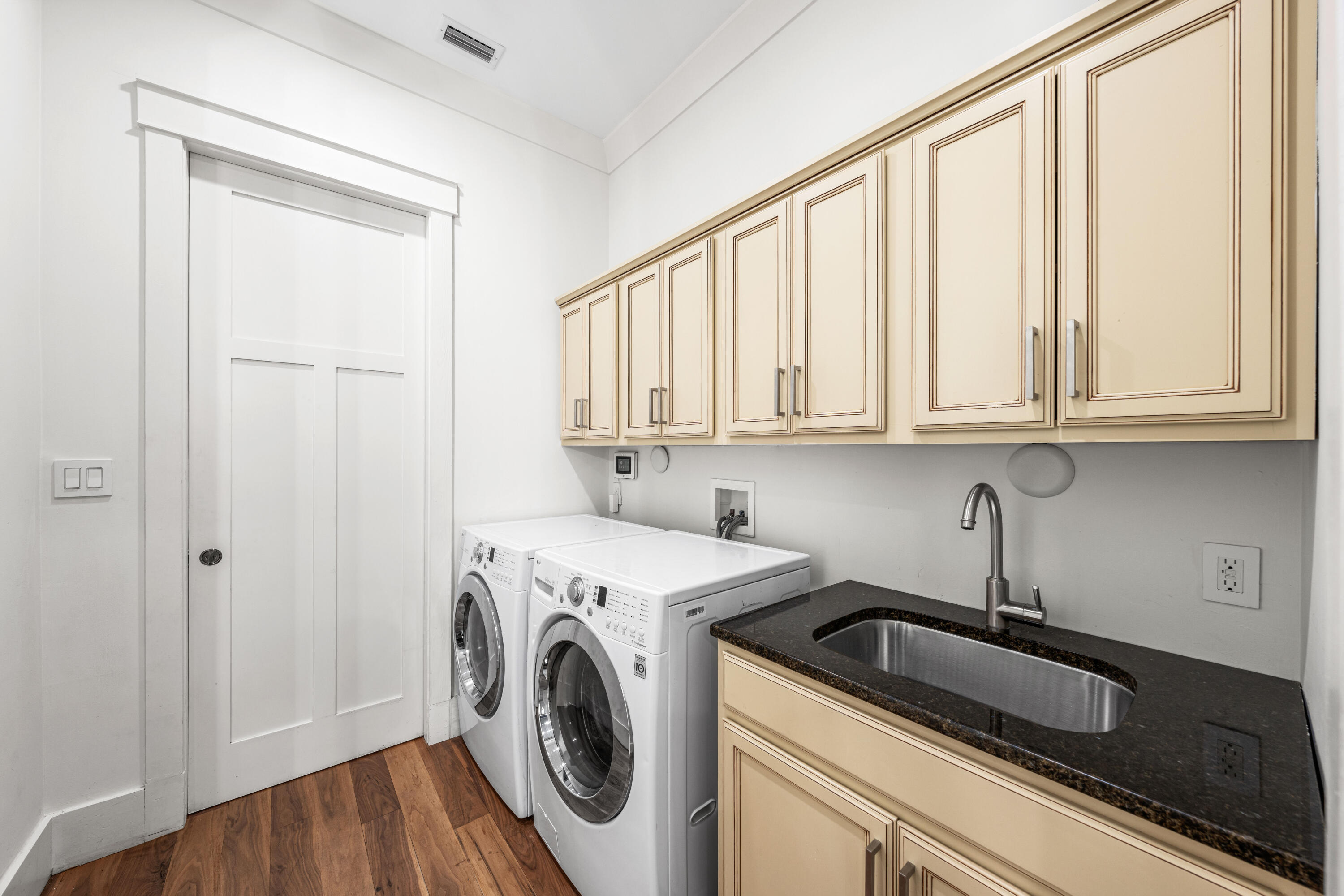 114 Pine Needle Way Santa Rosa Beach, FL 32459 - Photo 16 of 66 a view of a kitchen with sink and washer dryer