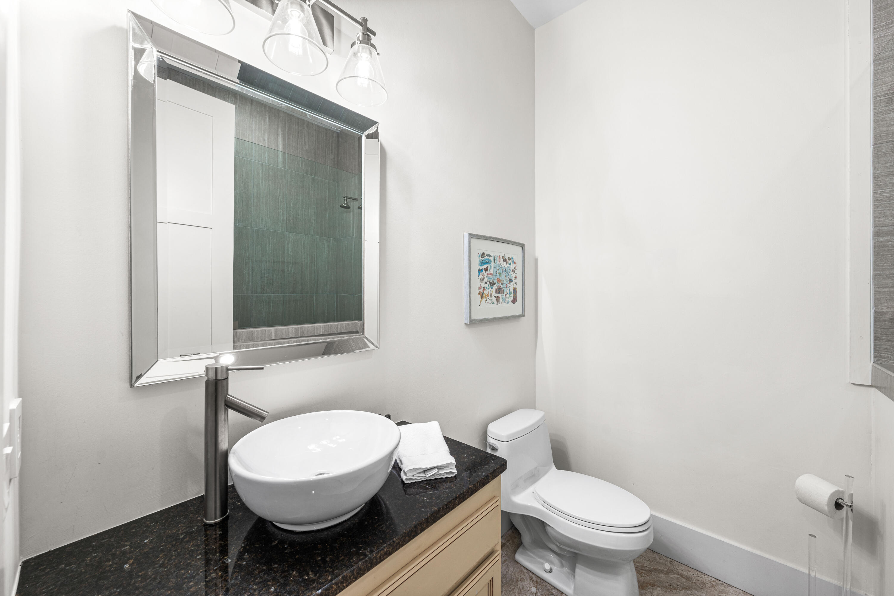 114 Pine Needle Way Santa Rosa Beach, FL 32459 - Photo 17 of 66 a white toilet sitting next to a bathroom sink