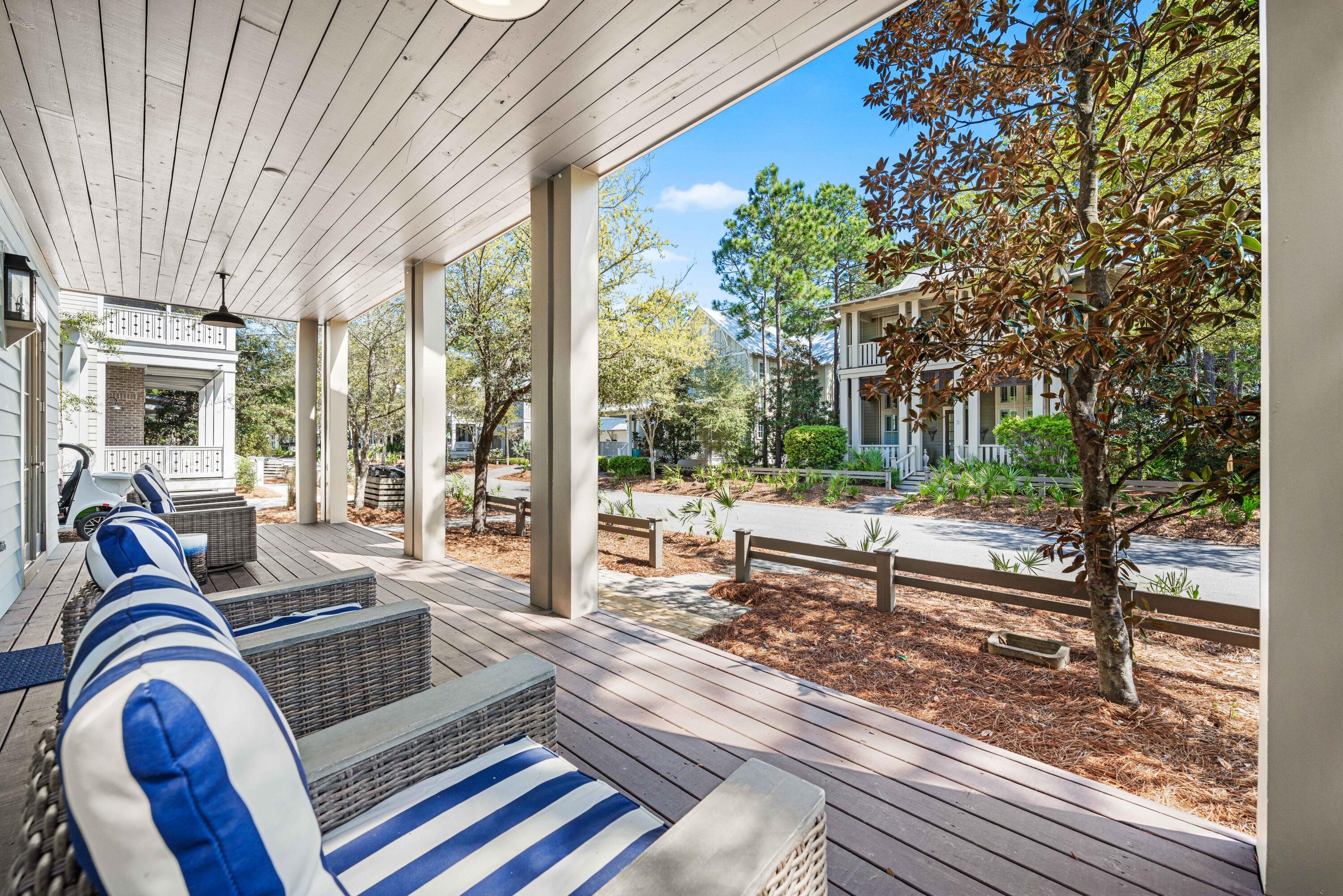 114 Pine Needle Way Santa Rosa Beach, FL 32459 - Photo 2 of 66 a living room with furniture and a floor to ceiling window