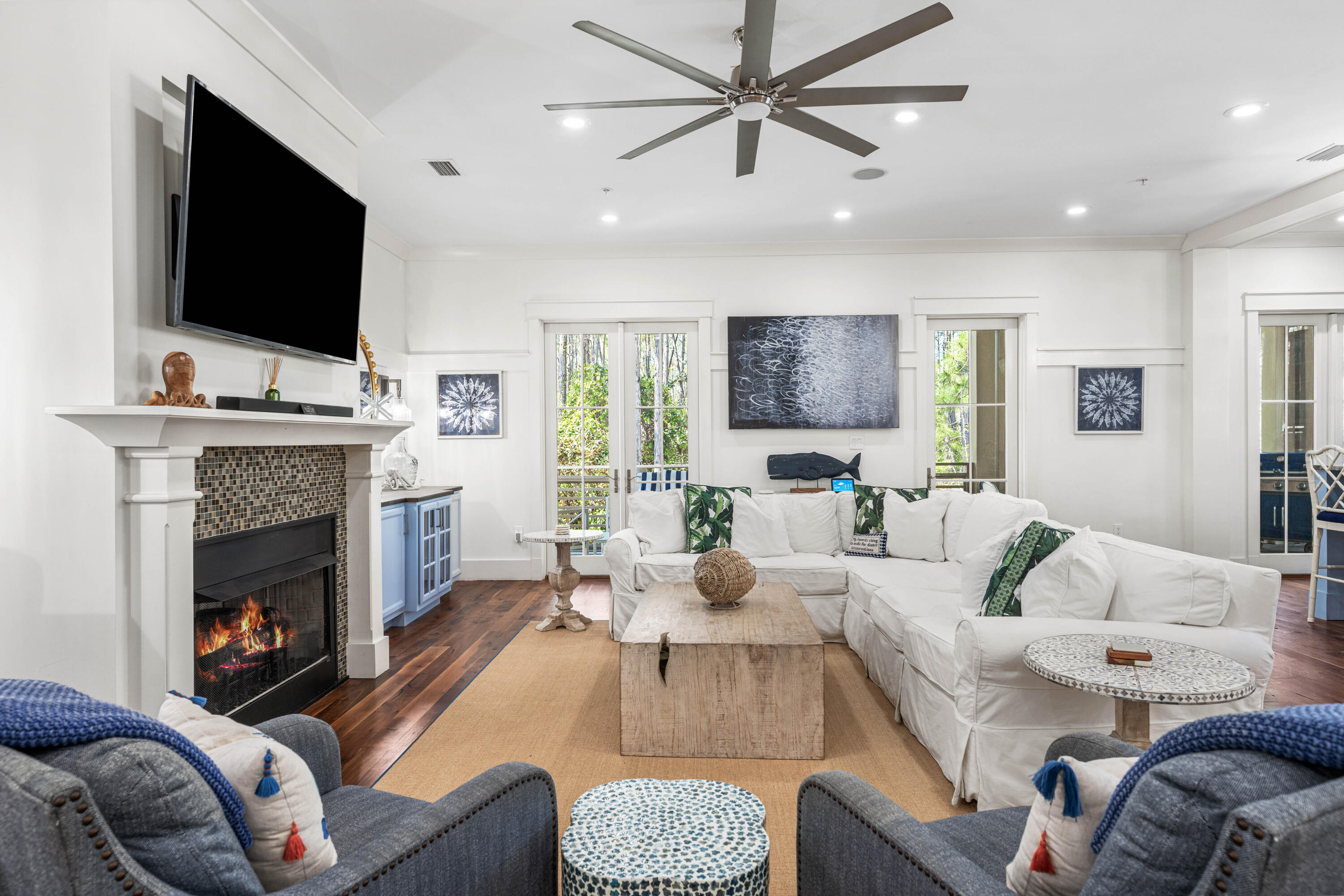 114 Pine Needle Way Santa Rosa Beach, FL 32459 - Photo 25 of 66 a living room with furniture a flat screen tv and a fireplace