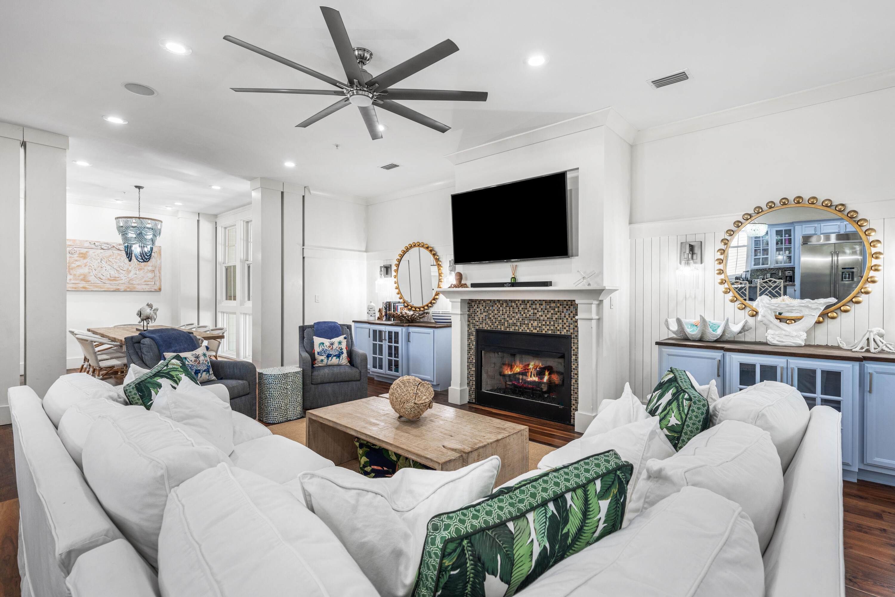 114 Pine Needle Way Santa Rosa Beach, FL 32459 - Photo 27 of 66 a living room with furniture a fireplace and a flat screen tv