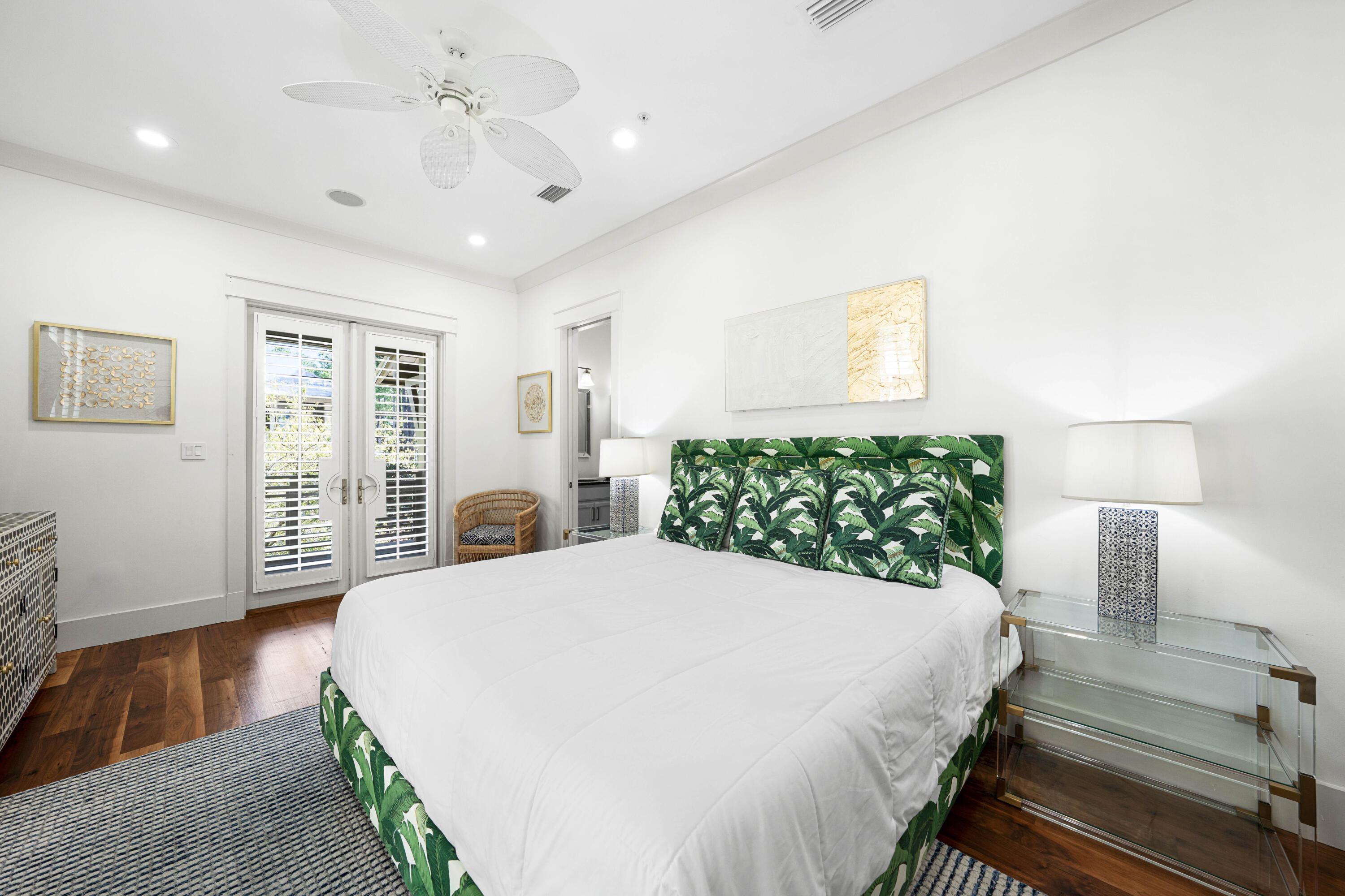 114 Pine Needle Way Santa Rosa Beach, FL 32459 - Photo 41 of 66 a spacious bedroom with a large bed and a chandelier
