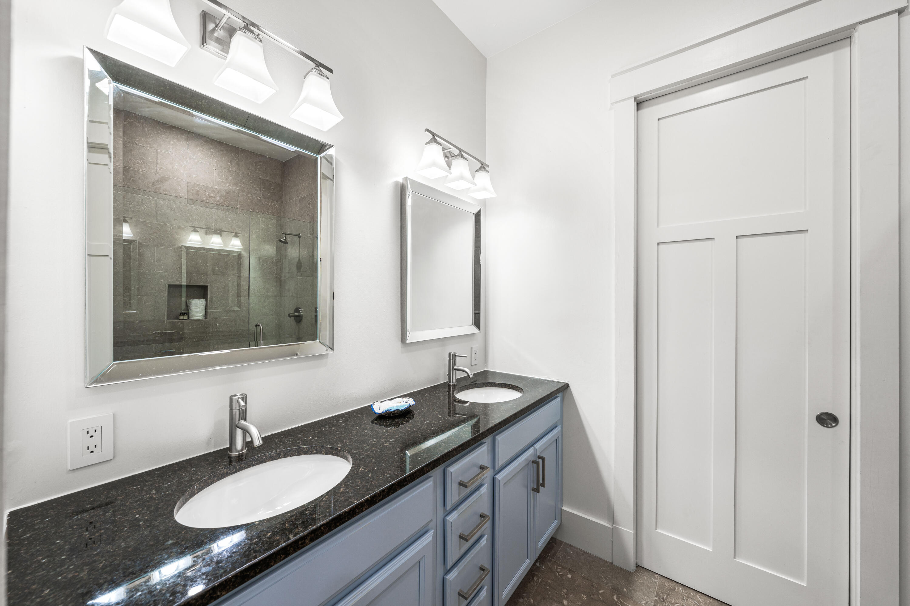 114 Pine Needle Way Santa Rosa Beach, FL 32459 - Photo 44 of 66 a bathroom with a granite countertop sink and a mirror