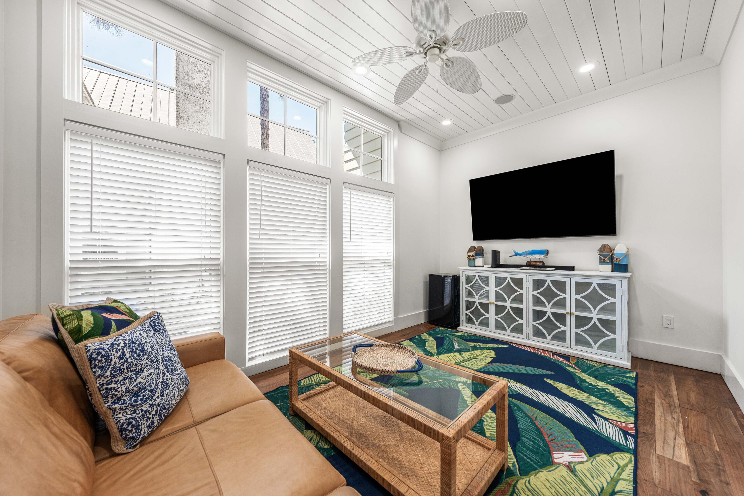 114 Pine Needle Way Santa Rosa Beach, FL 32459 - Photo 5 of 66 a living room with furniture and a flat screen tv