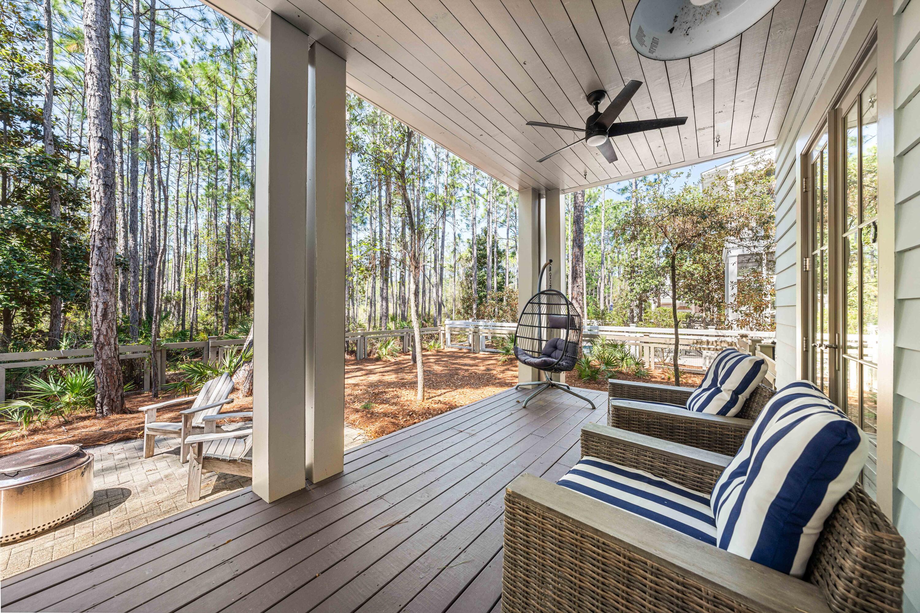 114 Pine Needle Way Santa Rosa Beach, FL 32459 - Photo 58 of 66 a living room with furniture and a floor to ceiling window