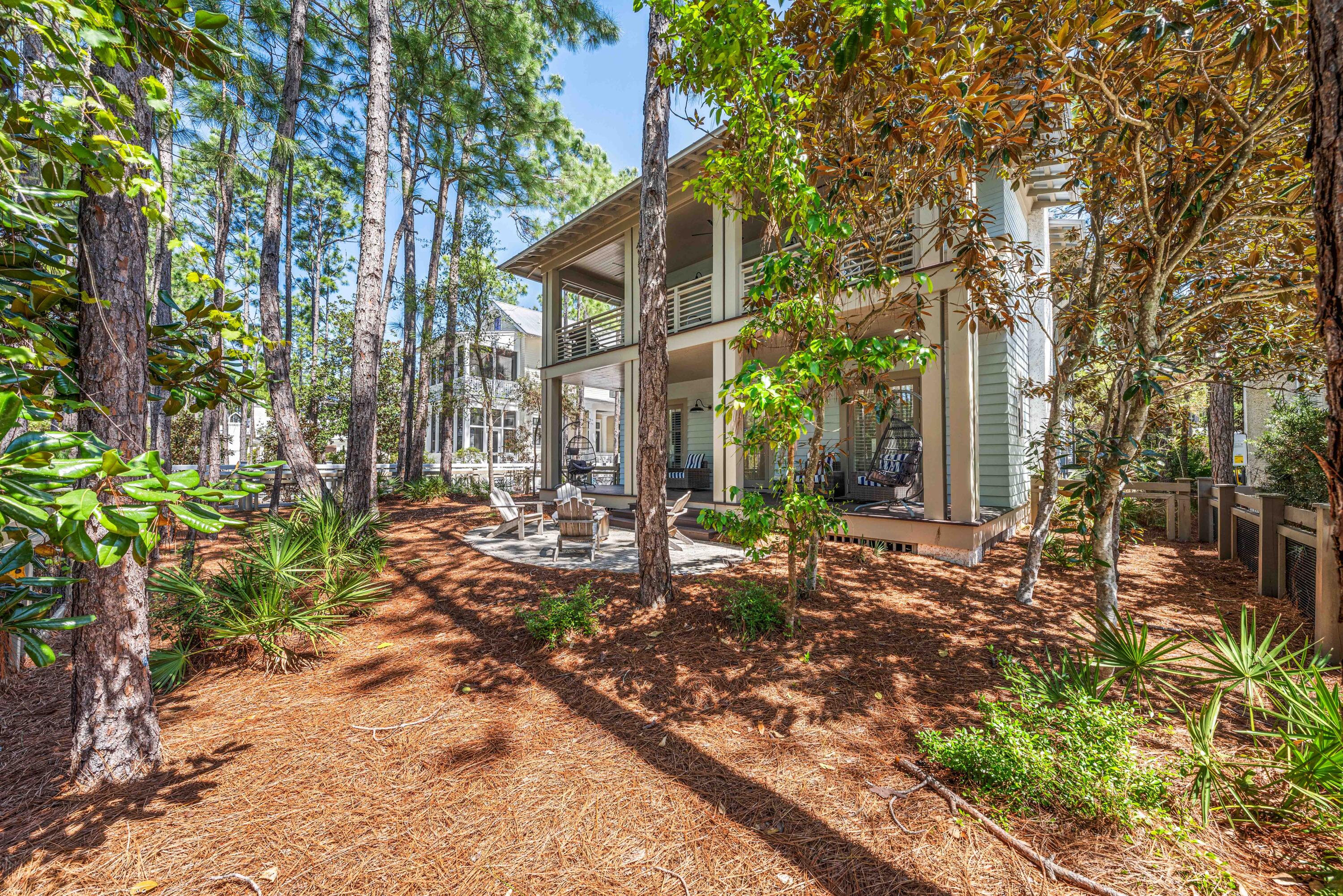 114 Pine Needle Way Santa Rosa Beach, FL 32459 - Photo 62 of 66 a front view of a house with a yard