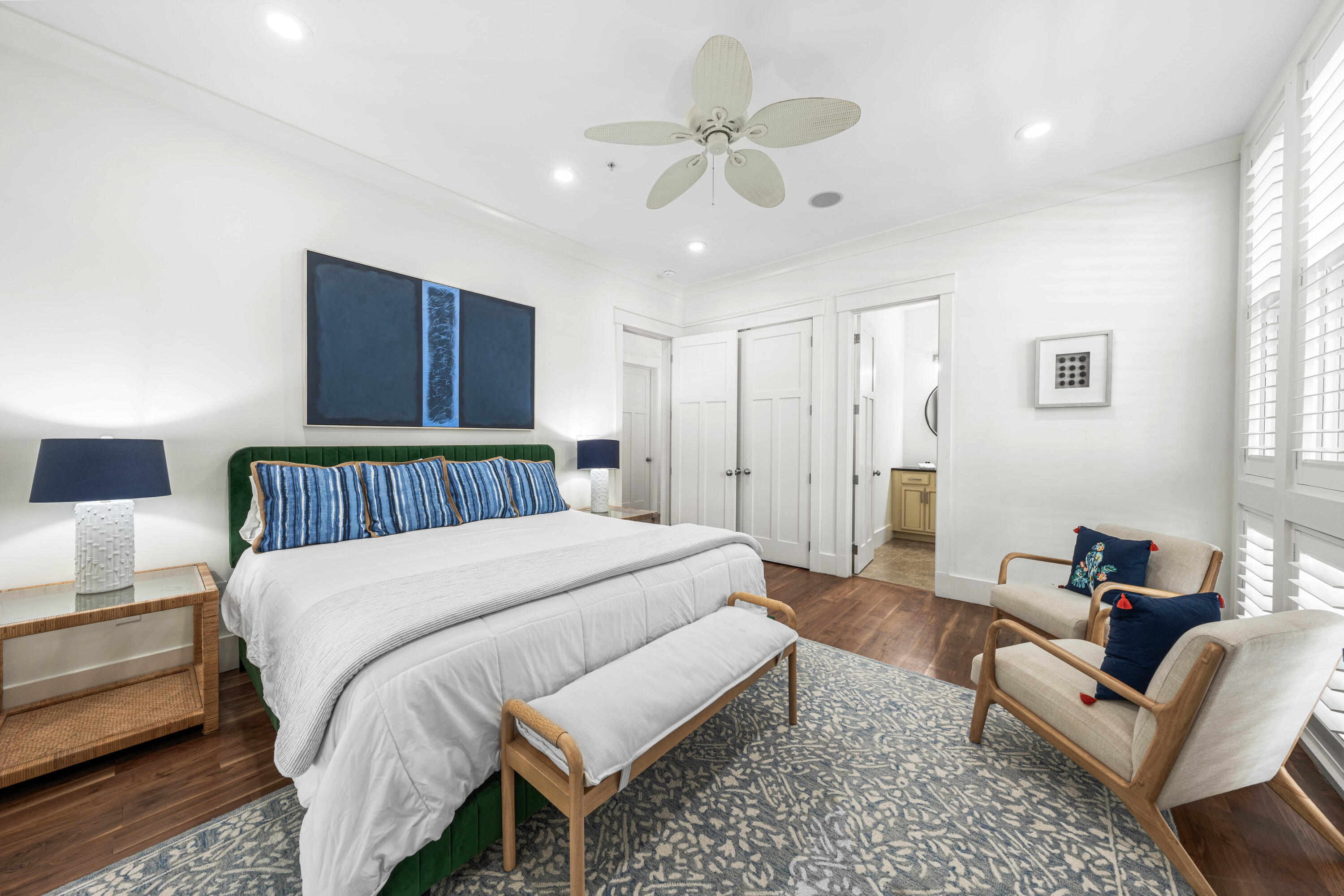 114 Pine Needle Way Santa Rosa Beach, FL 32459 - Photo 8 of 66 a spacious bedroom with a bed a couch and a chandelier