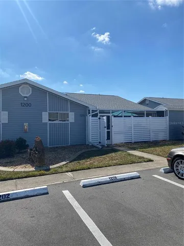 a swimming pool with a outdoor seating and yard