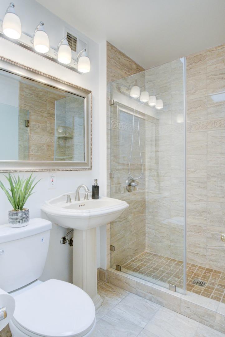 18444 Purdue Drive Saratoga, CA 95070 - Photo 13 of 31 a bathroom with a sink toilet and shower