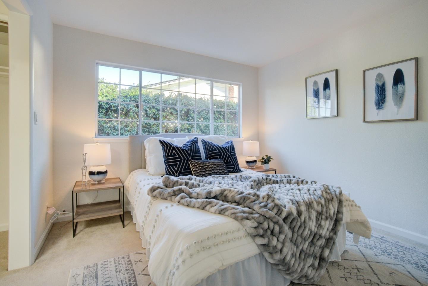 18444 Purdue Drive Saratoga, CA 95070 - Photo 14 of 31 a bedroom with a bed and a large window