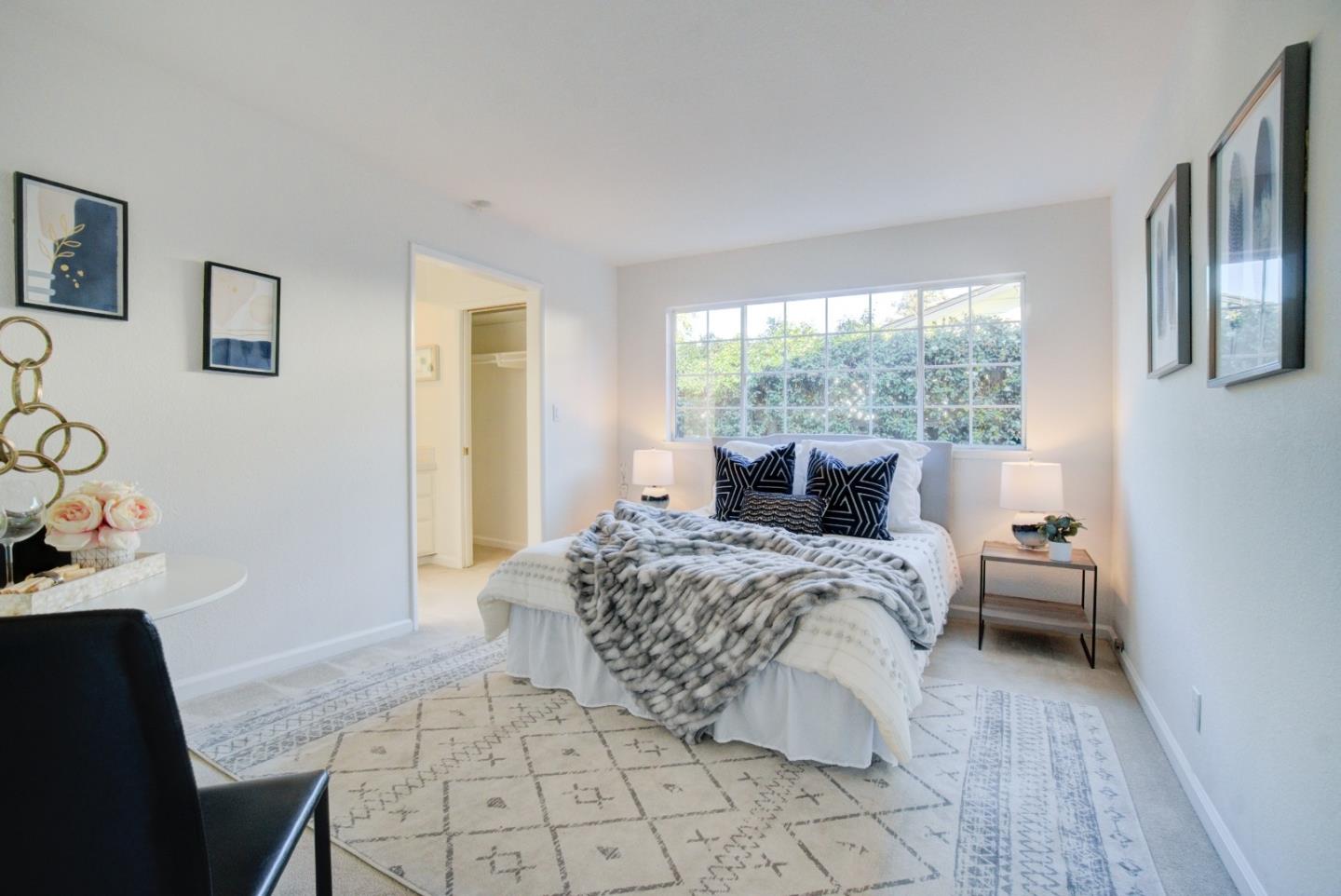 18444 Purdue Drive Saratoga, CA 95070 - Photo 15 of 31 a spacious bedroom with a bed and wooden floor